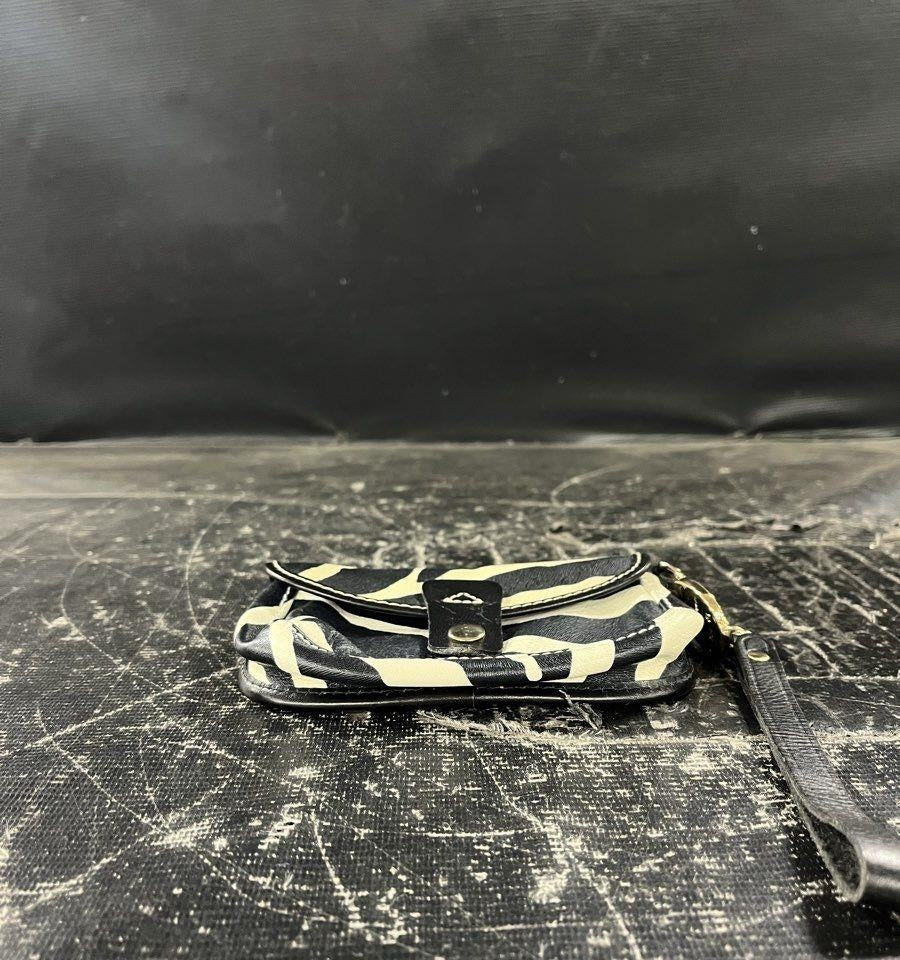 AGE REVIEW Dooney & Bourke Zebra Print Leather Flap Wristlet with Gold Hardware