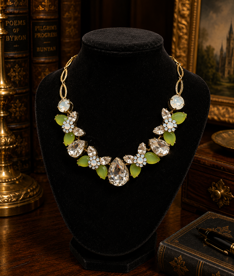 Gold-tone bib necklace with green and clear rhinestone clusters