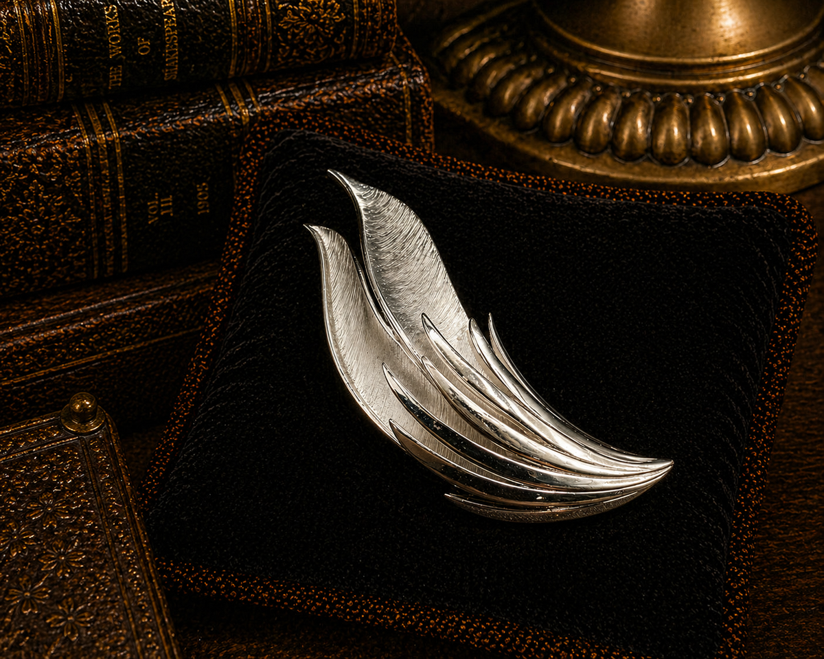Silver-tone feather leaf brooch with polished and brushed textures