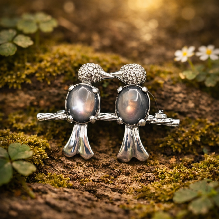 Signed A.S.Z. sterling double bird brooch with translucent Lucite-style bodies on a branch