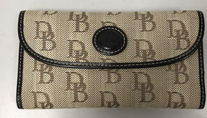 Beige monogram wallet with dark trim and rounded snap flap, view 2