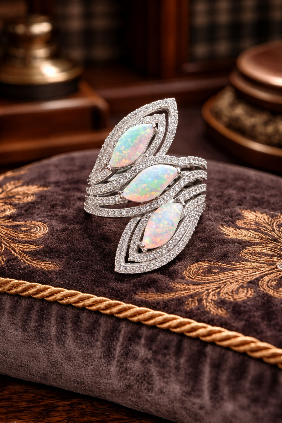 Silver-tone wrap ring with three iridescent opal-look marquise stones and clear crystals