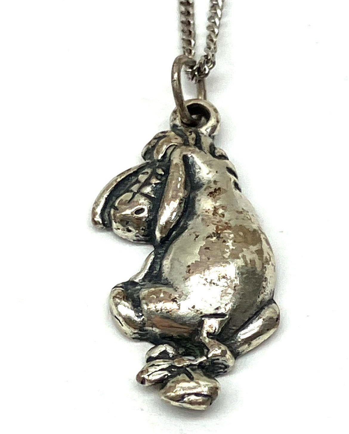 Silver Eeyore character pendant in a seated pose on a fine chain, view 8