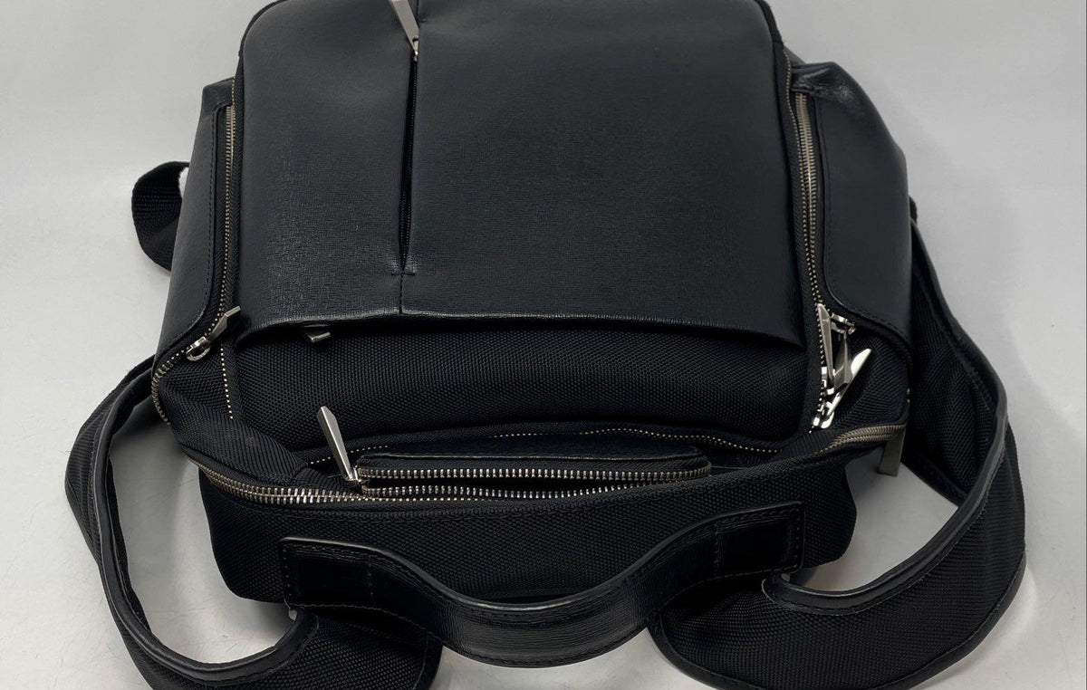Barneys New York black backpack with adjustable straps, top handle and front zip pocket, view 3