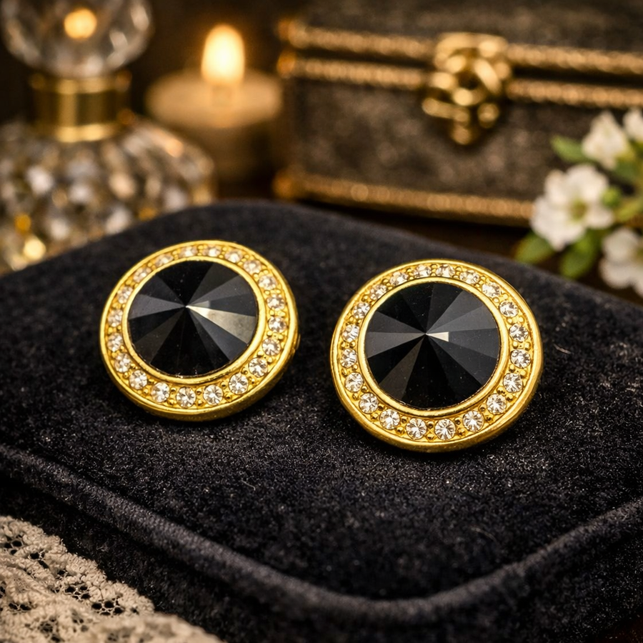Gold-tone round button clip-on earrings with black crystal centers and clear crystal halo