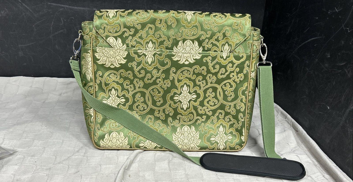 Green damask pattern flap-front briefcase bag with shoulder strap and pink lining, view 4