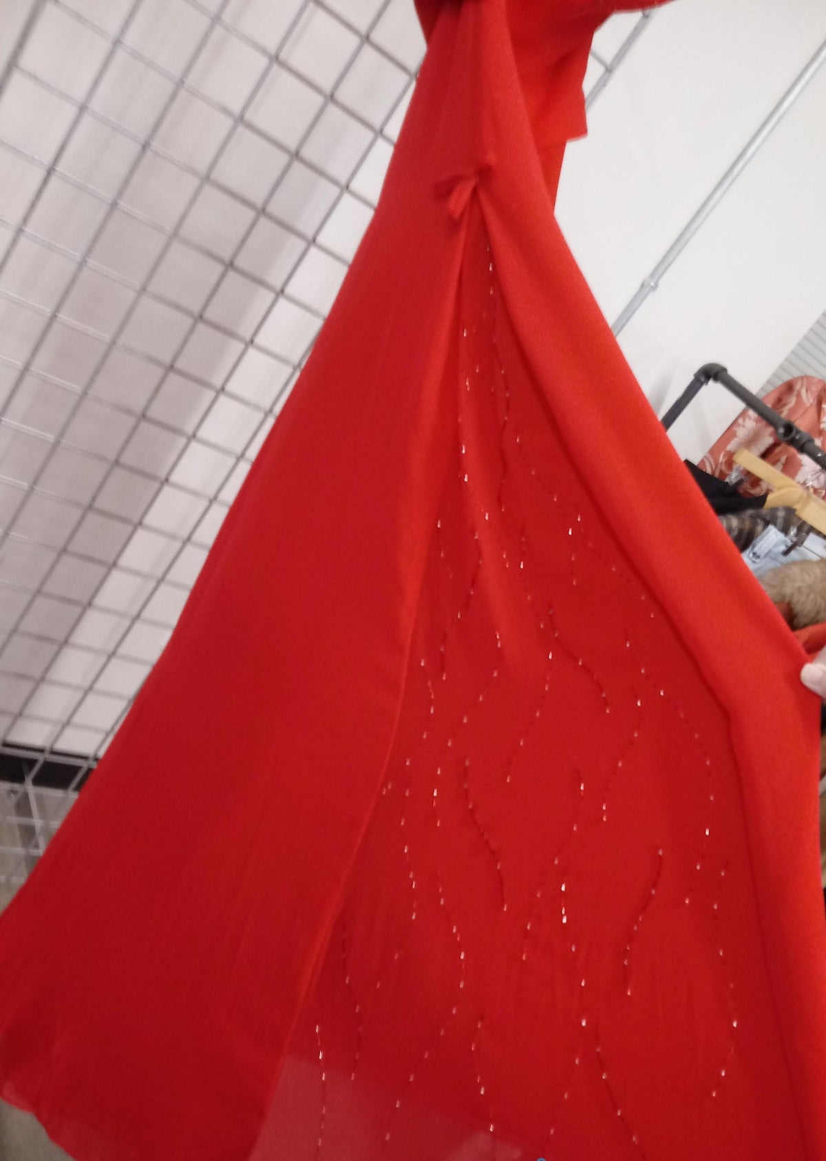 Red strapless formal dress with draped bodice, beaded detail and high-low hem, view 5