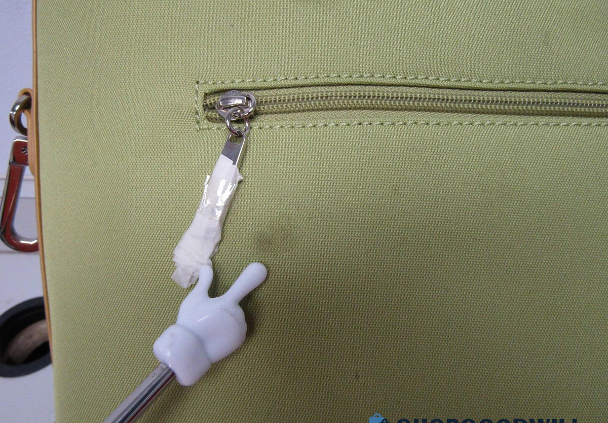Soft green shoulder bag with tan accents, gold-tone hardware and coordinating pouch, view 3