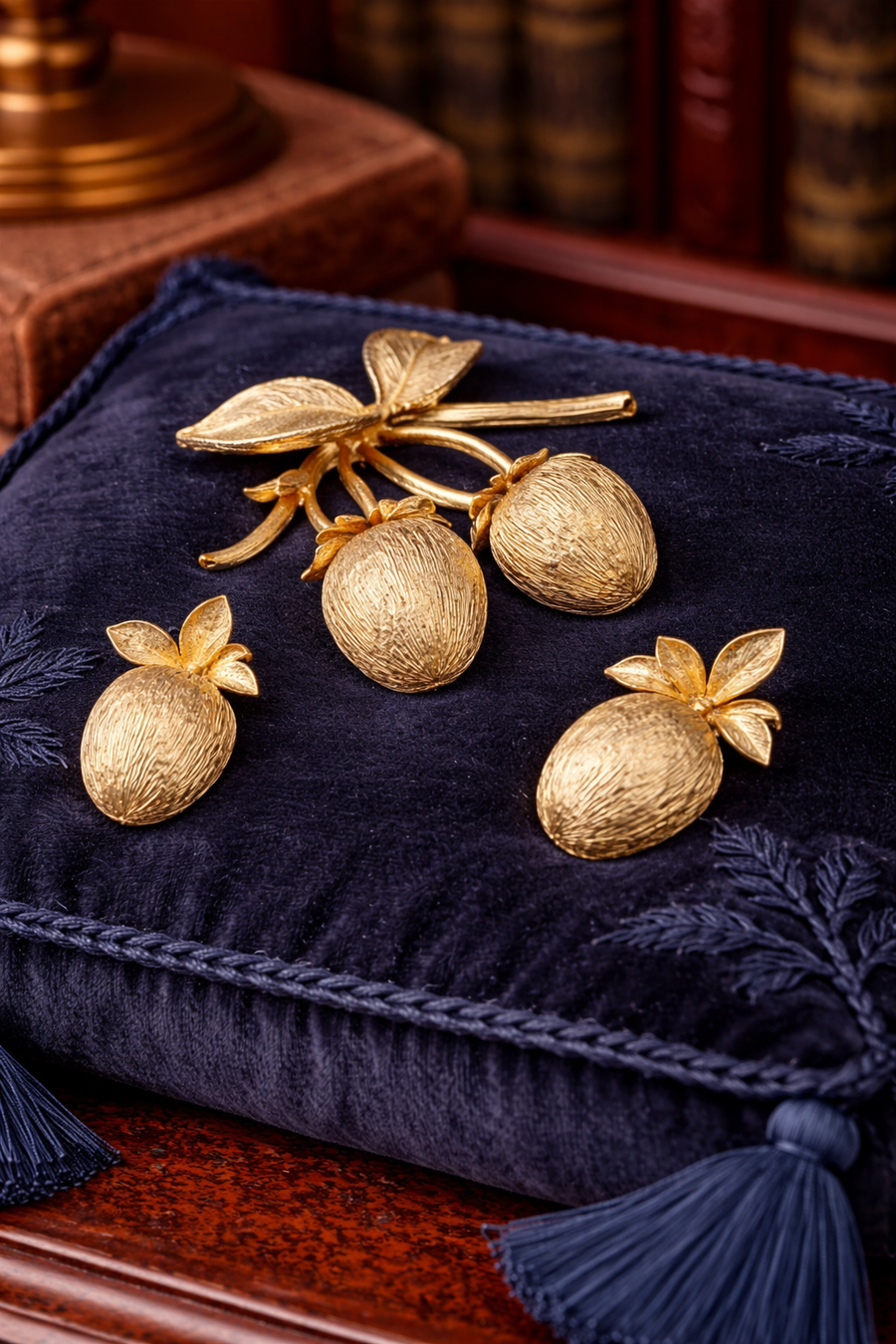 Gold-tone berry branch brooch and matching clip-on earrings with brushed etched finish