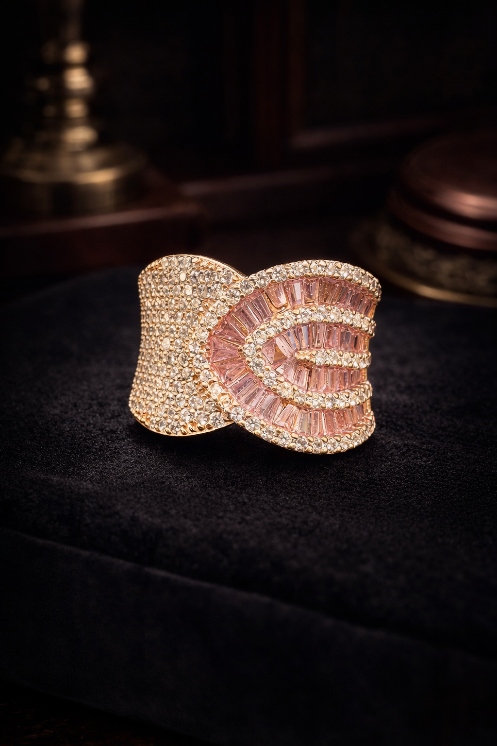 Rose gold-tone sculptural ring with pink rectangular crystals and clear pavé
