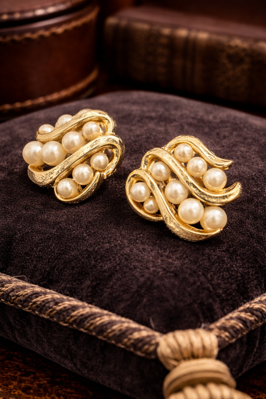 Signed Trifari gold-tone swirl clip earrings with clustered faux pearls