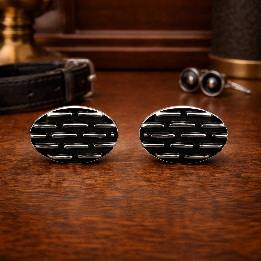 Vintage silver tone oval tie tack set with black enamel geometric pattern and chain back