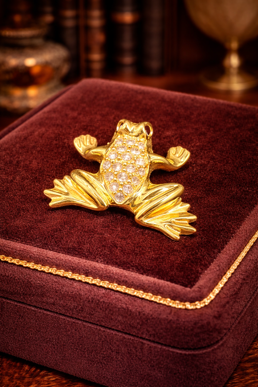 Swarovski gold-tone frog brooch with clear pavé crystals and crystal eye
