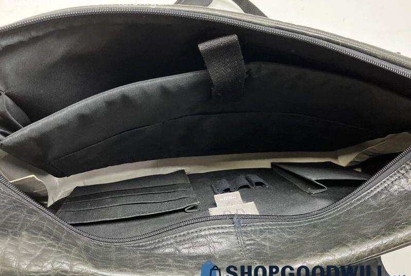 Black leather messenger bag with front buckle straps, top handle and adjustable shoulder strap, view 6