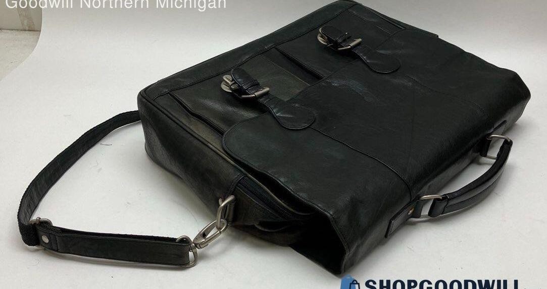 Black leather messenger bag with front buckle straps, top handle and adjustable shoulder strap, view 7