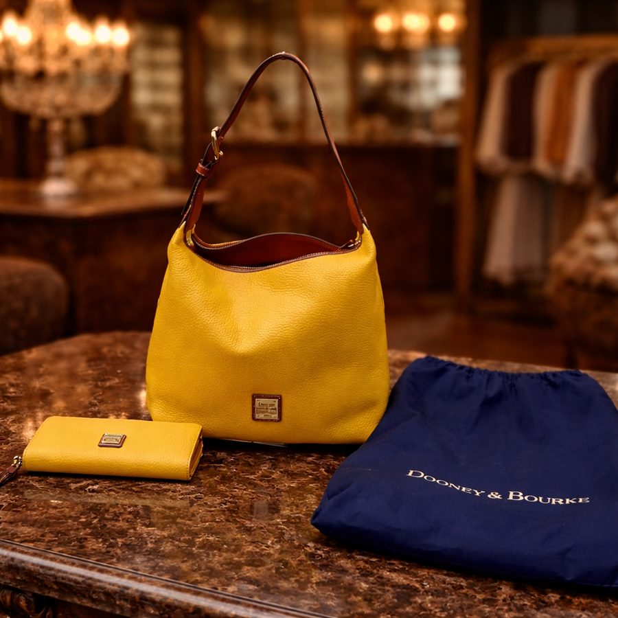 Dooney and Bourke dandelion yellow pebble grain hobo bag with matching wallet and dust bag