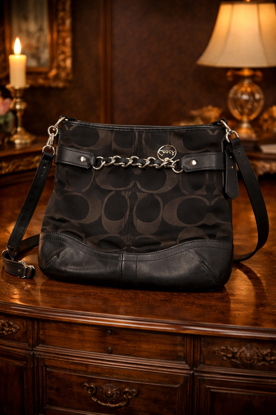 Coach Signature C black canvas crossbody with black leather trim and chain accent
