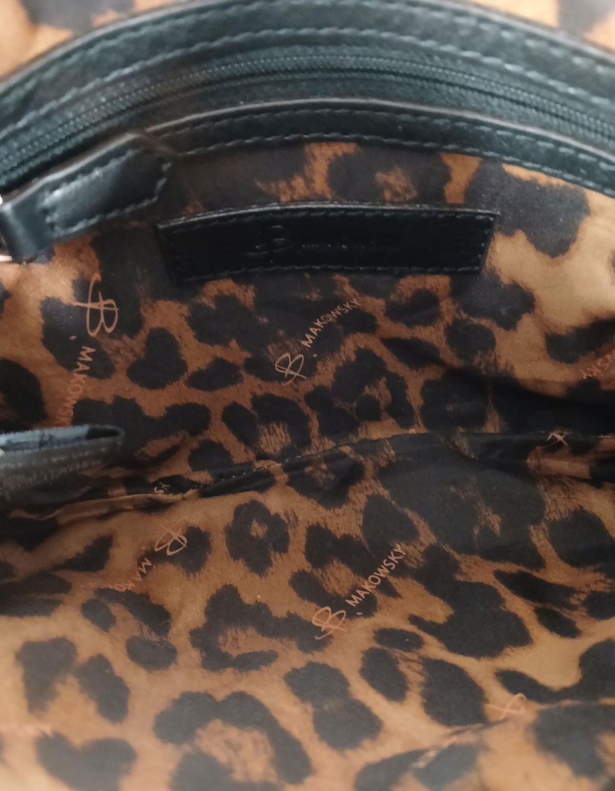 B. Makowsky brown and black crossbody bag with front logo plate and long strap, view 4