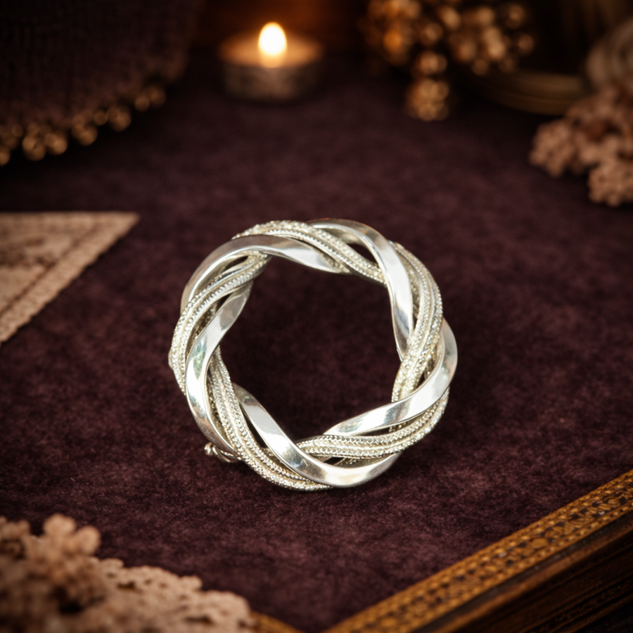 Silver-tone textured leaf wreath circle brooch with open center