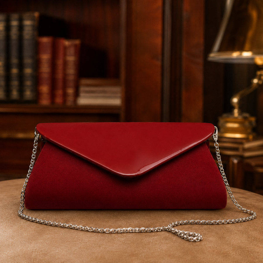 Red envelope clutch with flap front and long silver-tone chain shoulder strap