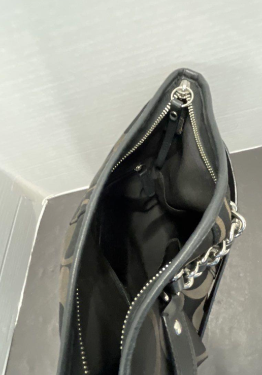 Coach Signature C black canvas crossbody with black leather trim and chain accent, view 4
