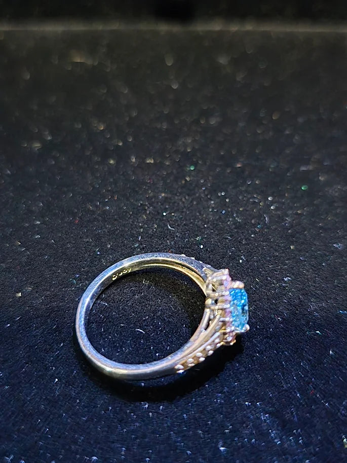 D'Joy silver-tone ring with blue center stone, pink-red halo and clear accent stones, view 7