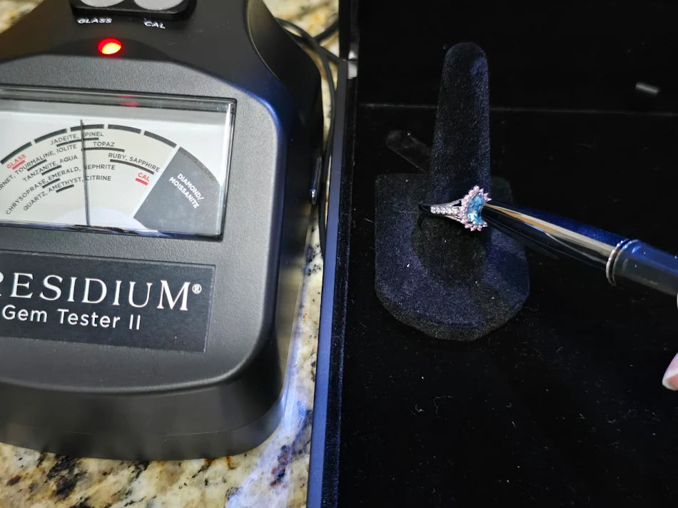 D’Joy Platinum over Sterling Silver Blue Topaz Solitaire Ring with Ruby Halo & Diamond Accents