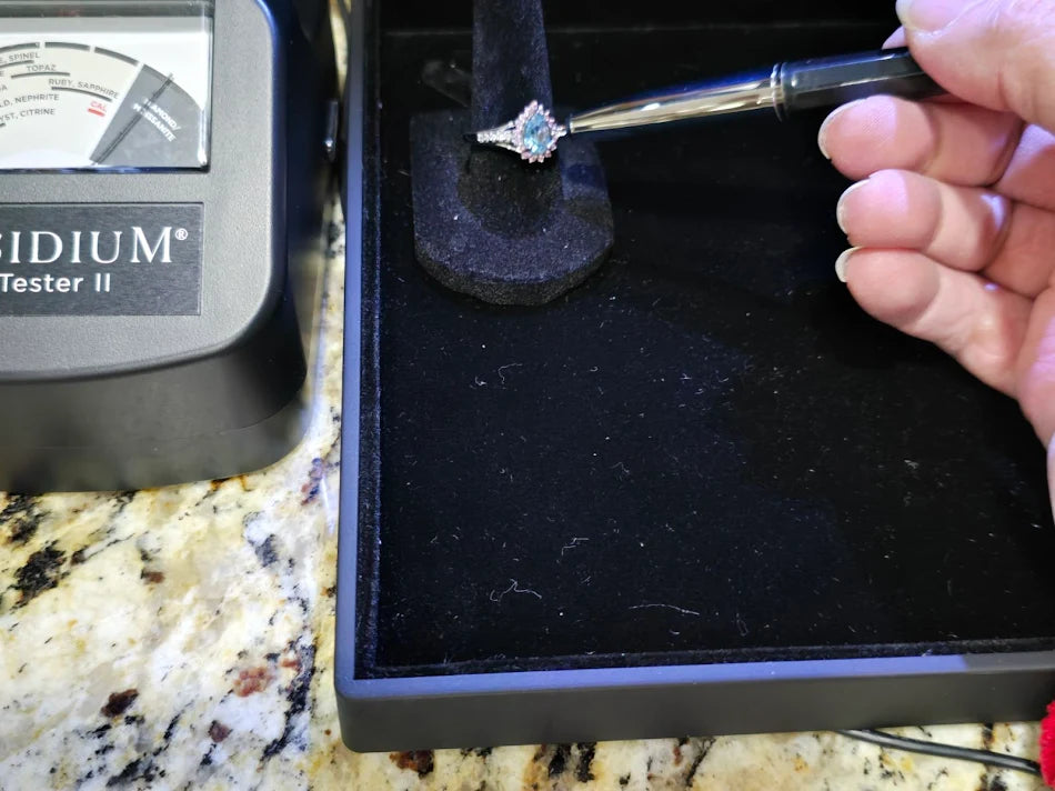 D’Joy Platinum over Sterling Silver Blue Topaz Solitaire Ring with Ruby Halo & Diamond Accents