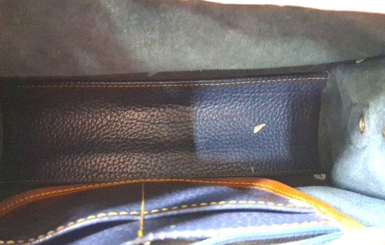 Dooney and Bourke navy pebbled leather barrel crossbody with British tan trim and duck medallion, view 4