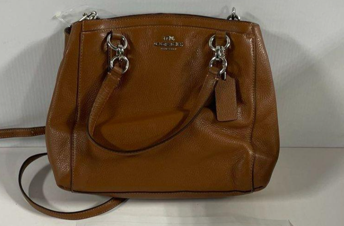Brown pebbled leather carryall satchel with rolled handles and crossbody strap, view 2