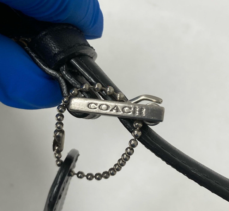 Coach small black leather crossbody clutch with silver-tone hangtag, view 5