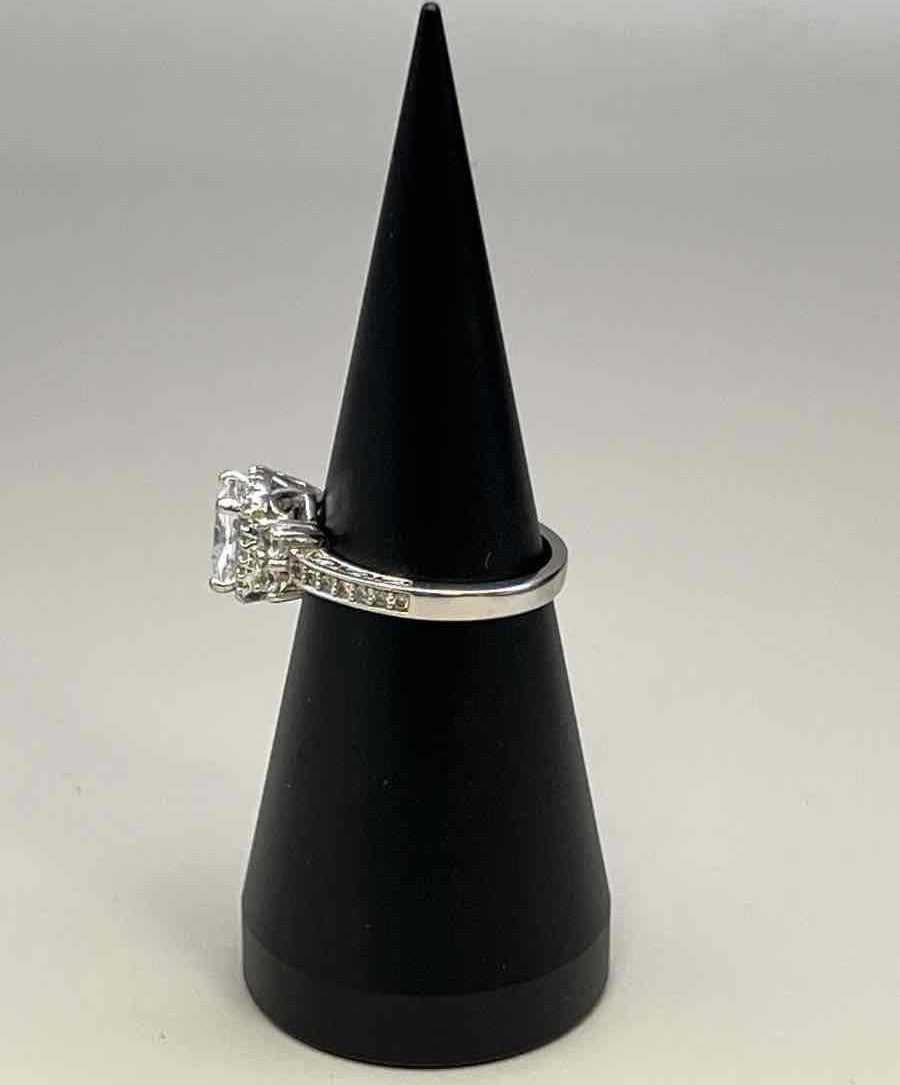 Silver-tone ring with large clear center stone and crystal accents, size 8.5, view 8