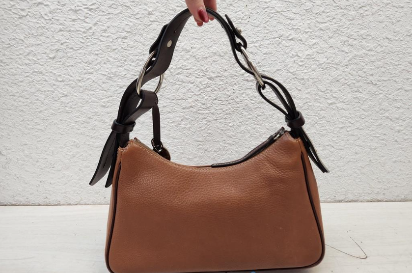 Dooney and Bourke 1975 tan pebbled leather east-west hobo with dark trim and duck charm, view 8