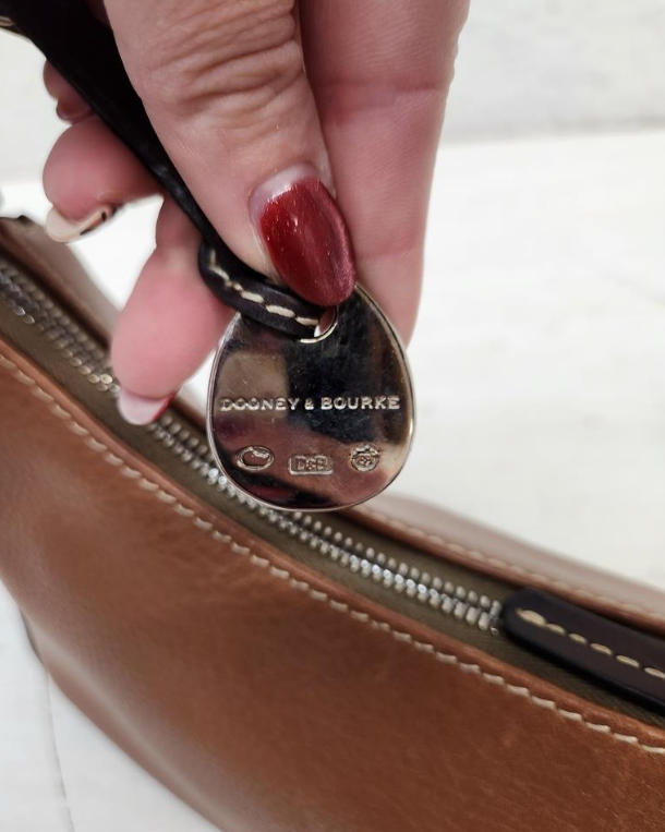 Dooney and Bourke 1975 tan pebbled leather east-west hobo with dark trim and duck charm, view 5