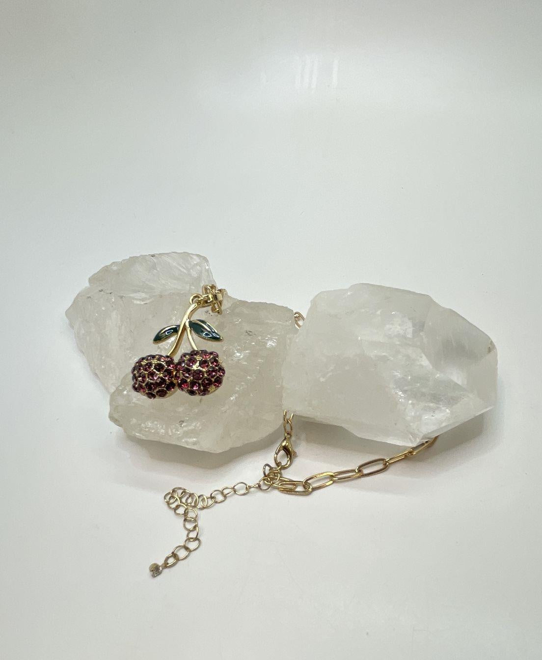 Gold-tone cherry pendant necklace with pink rhinestone fruit and green leaves, view 3