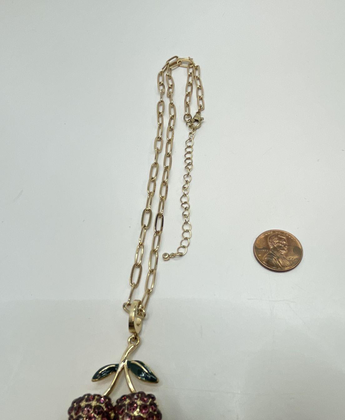 Gold-tone cherry pendant necklace with pink rhinestone fruit and green leaves, view 4