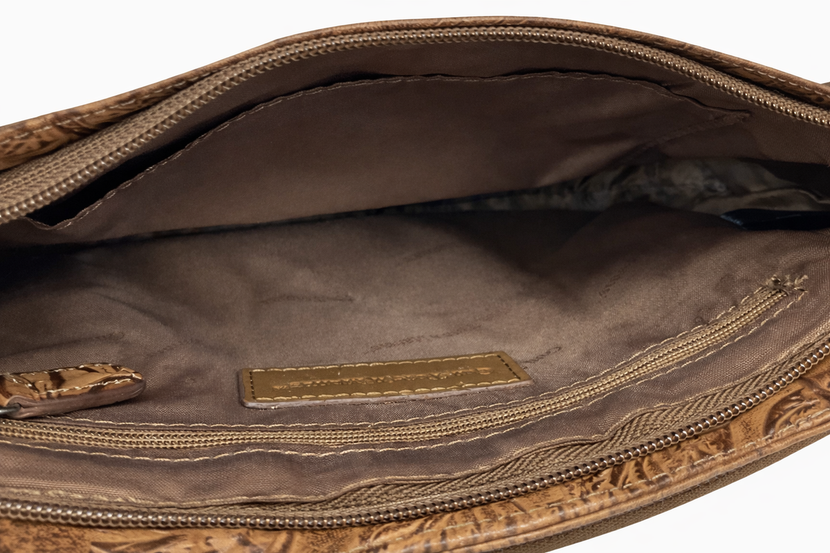 Brown floral tooled leather crossbody bag with flap pocket and zip top, view 3