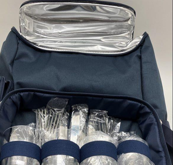 Navy insulated picnic backpack with rolled blanket, cups, plates and utensils, view 5