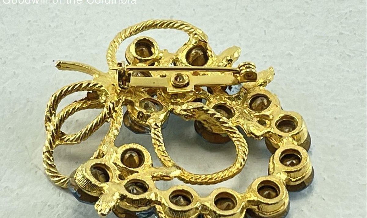 Gold-tone openwork brooch with blue rhinestone cluster and green enamel leaves, view 5