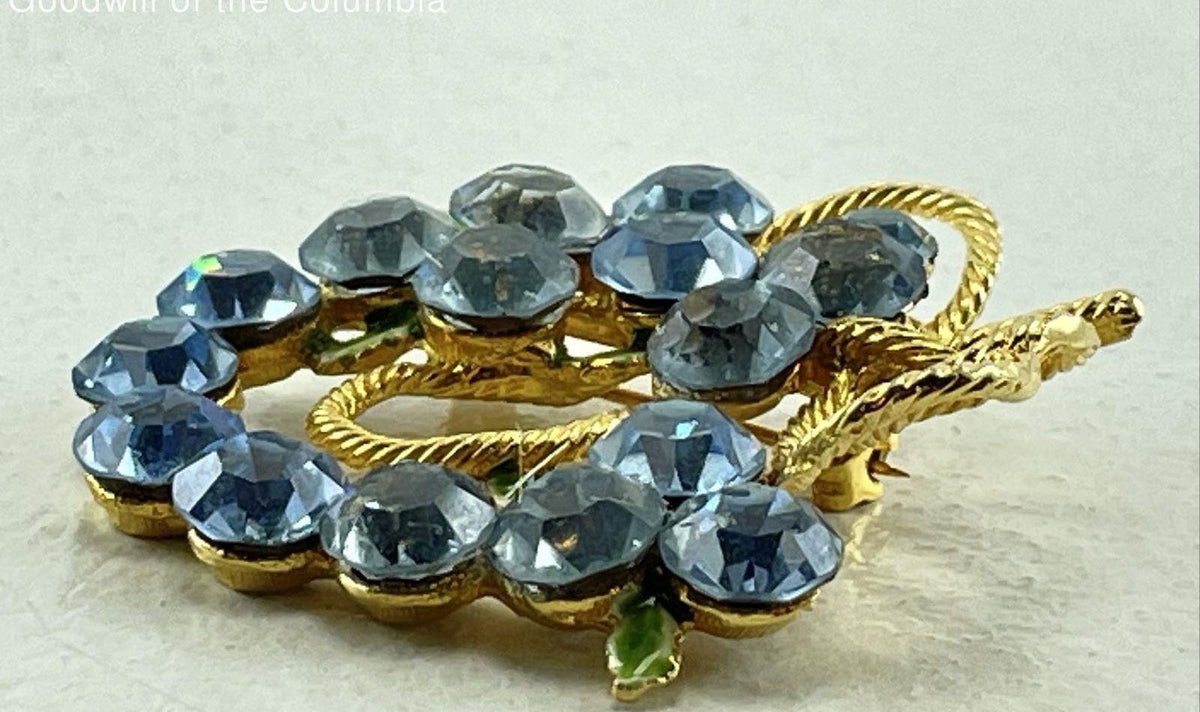Gold-tone openwork brooch with blue rhinestone cluster and green enamel leaves, view 6