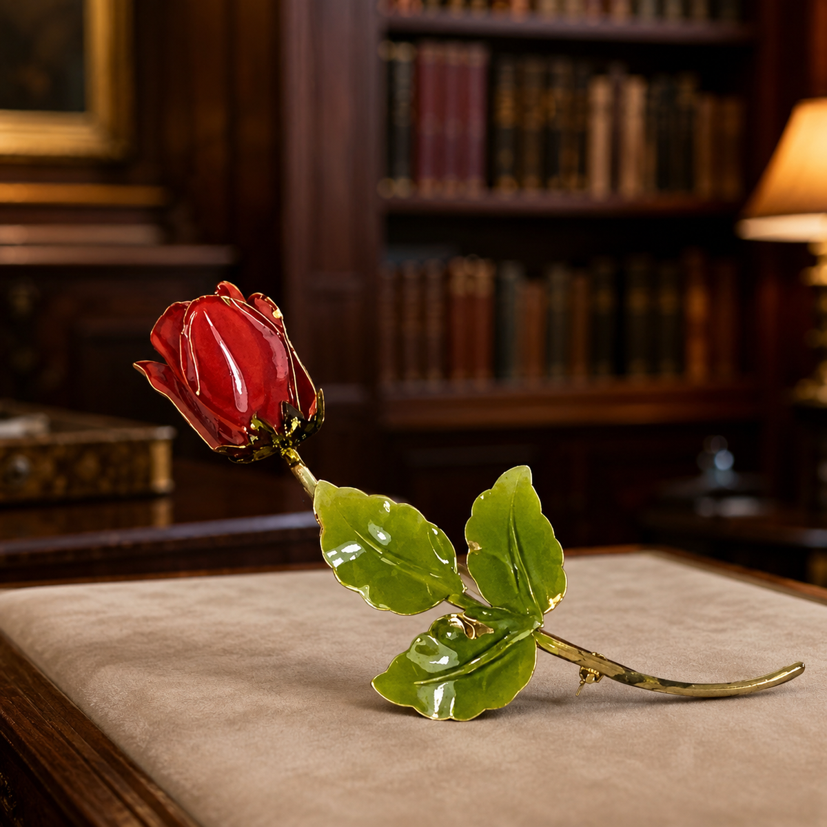 Gold-tone long-stemmed rose brooch with red and green enamel