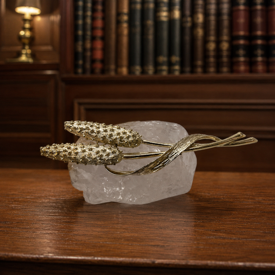 Gold-tone cattail brooch with slim botanical lines