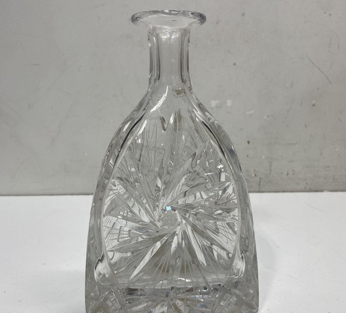 Clear cut glass decanter with deep-cut pinwheel and star pattern, view 3