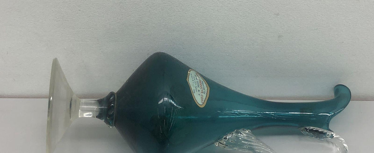 Teal glass ewer with teardrop body, curled lip, clear twisted applied handle and clear foot, view 4