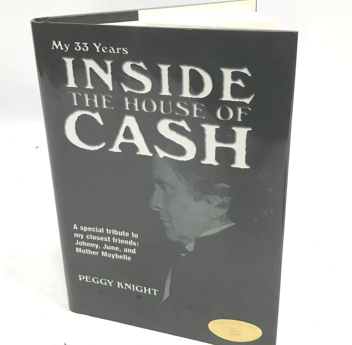 Inside the House of Cash by Peggy Knight, black cover with autographed copy sticker, view 2