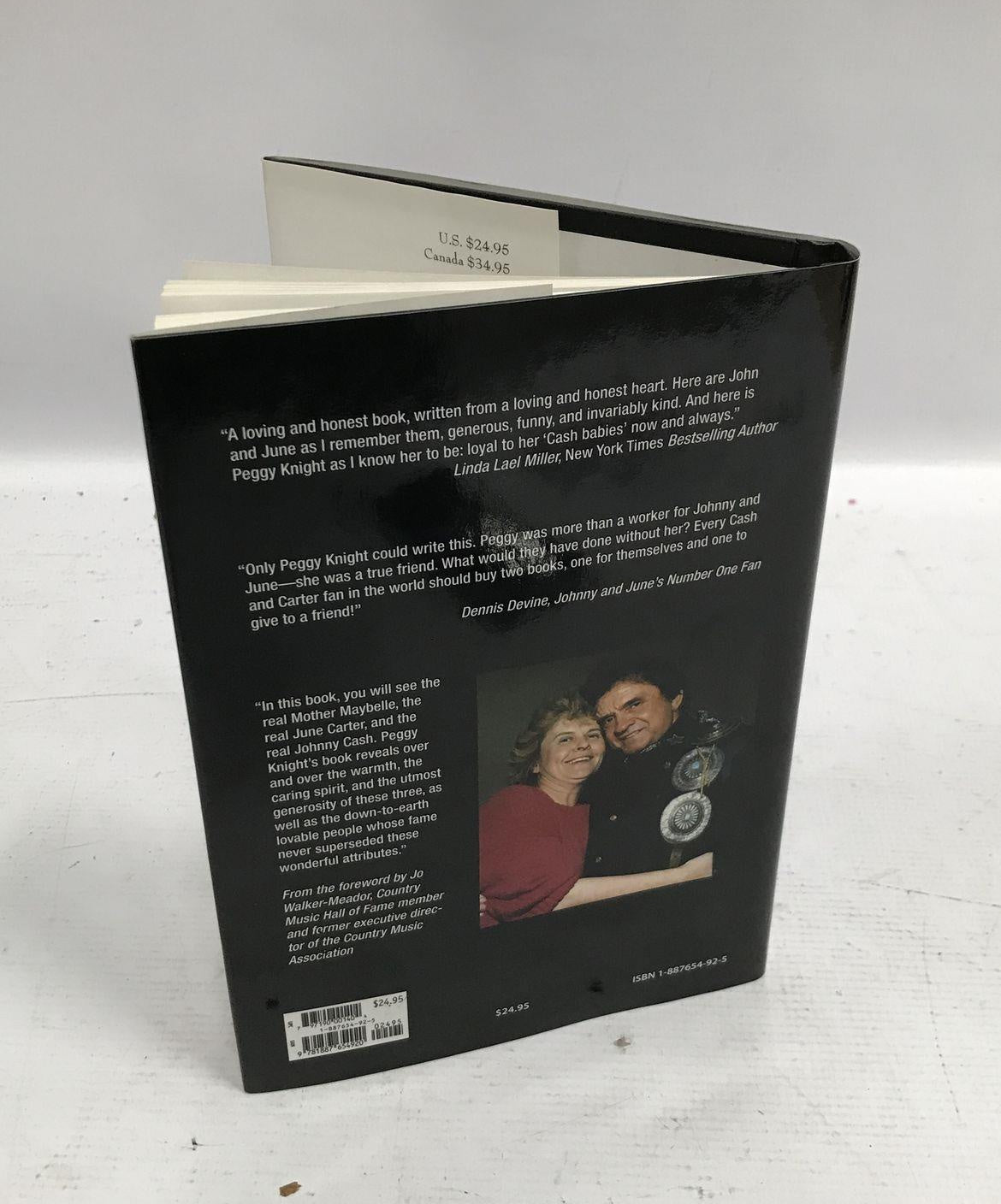Inside the House of Cash by Peggy Knight, black cover with autographed copy sticker, view 3
