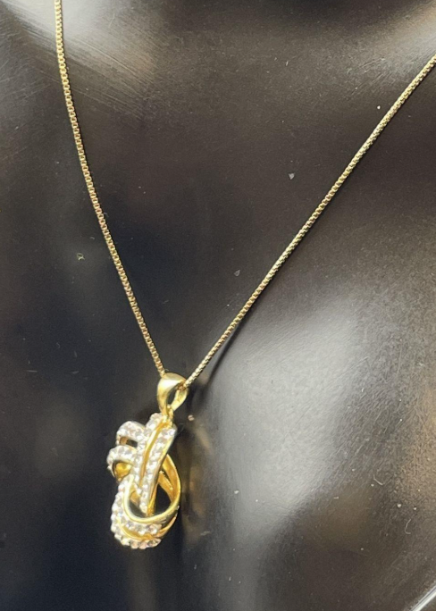 Signed JCM gold-tone interlocking knot pendant necklace with clear rhinestones, view 3