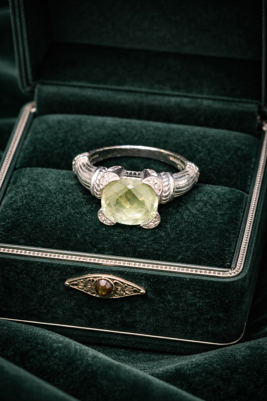 Judith Ripka silver-tone ring with green cushion-cut center stone and textured band