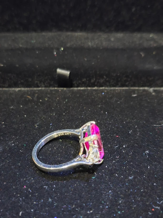 Silver-tone cocktail ring with emerald-cut red center stone and clear trillion side stones, view 5
