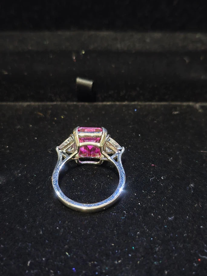 Silver-tone cocktail ring with emerald-cut red center stone and clear trillion side stones, view 4